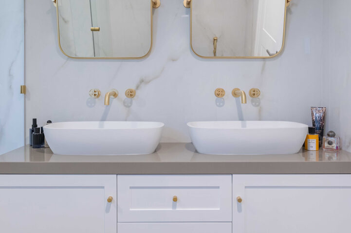 Modern bathroom interior with double basins and mirrors in a Dubai residence, architectural interior photography by IBN Films