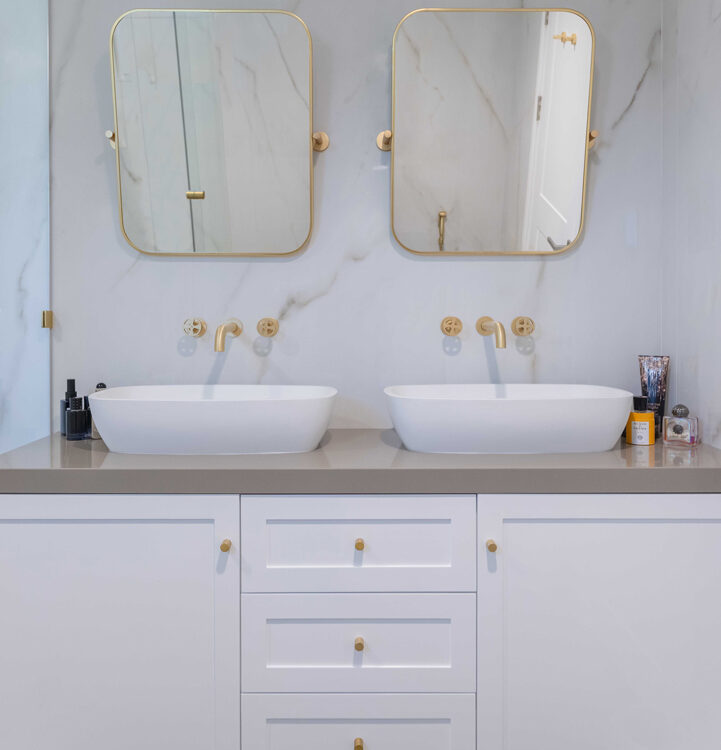 Modern bathroom interior with double basins and mirrors in a Dubai residence, architectural interior photography by IBN Films