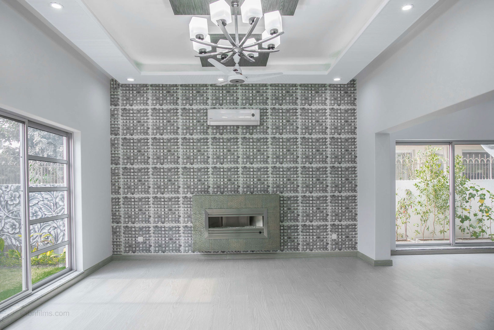 Modern drawing room interior with built-in stove in a luxury Dubai residence, architectural interior photography by IBN Films