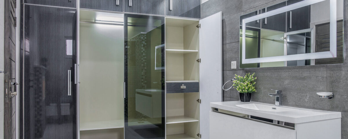 Modern bathroom interior in Dubai featuring stylish storage shelves, photographed by IBN Films.