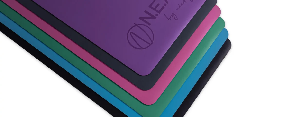 Colorful neat yoga mats stack professional photography by IBNFilms