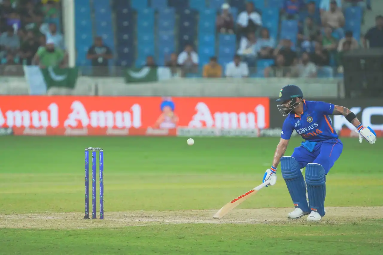 Cricket batsman executing a shot during a match in Dubai, UAE, photographed by IBN Films