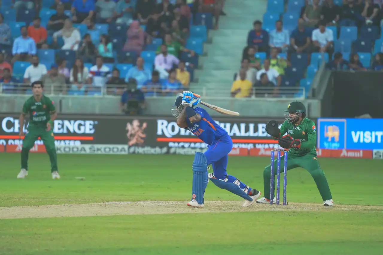 Cricket batsman captured in action during a match in Dubai, UAE, photographed by IBN Films