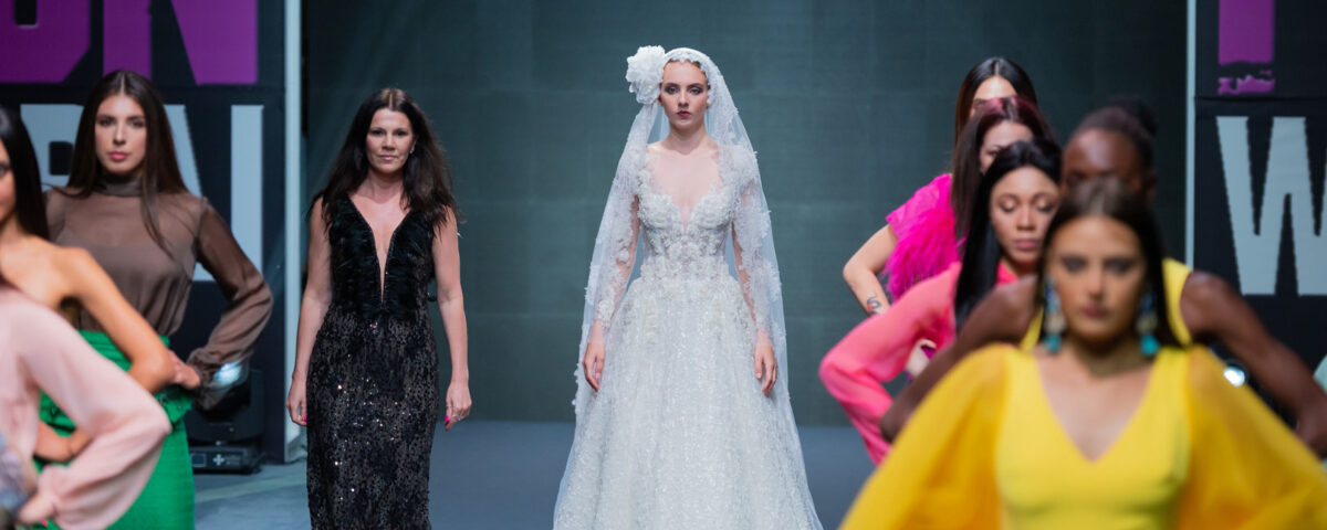 Designer fashion finale in Dubai UAE showcasing a grand runway closing with multiple models and luxury designs