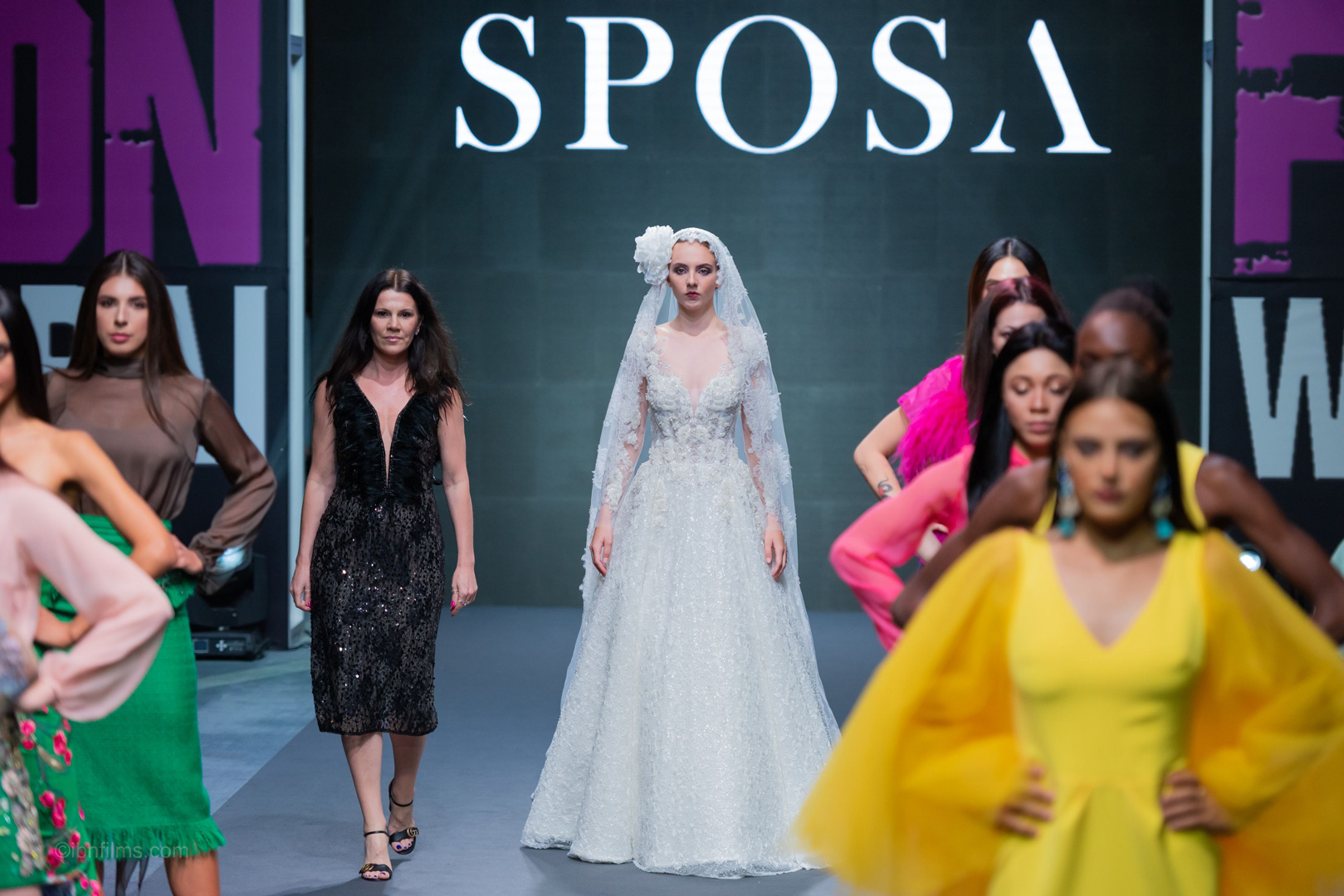 Designer fashion finale in Dubai UAE showcasing a grand runway closing with multiple models and luxury designs