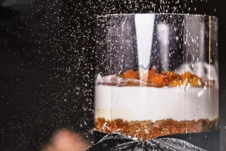 Layered dessert served in a glass jar styled for food photography in Dubai, captured by IBN Films.