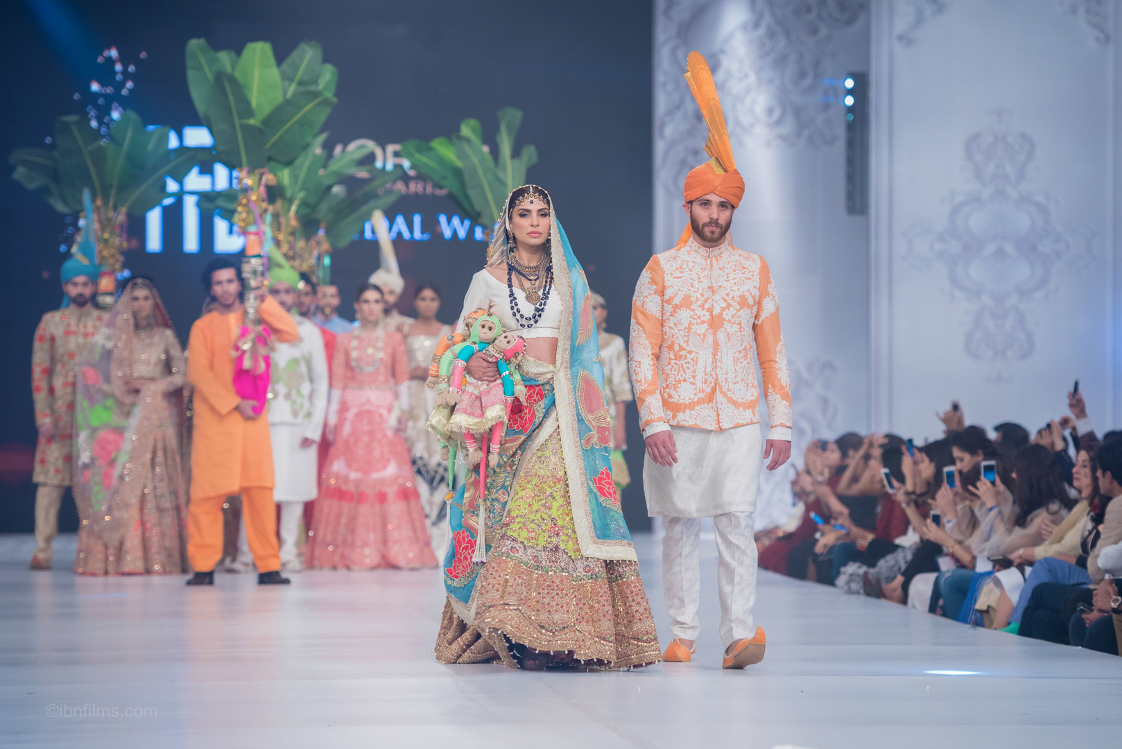 Group fashion runway photography in Dubai featuring multiple models walking together on a luxury fashion runway