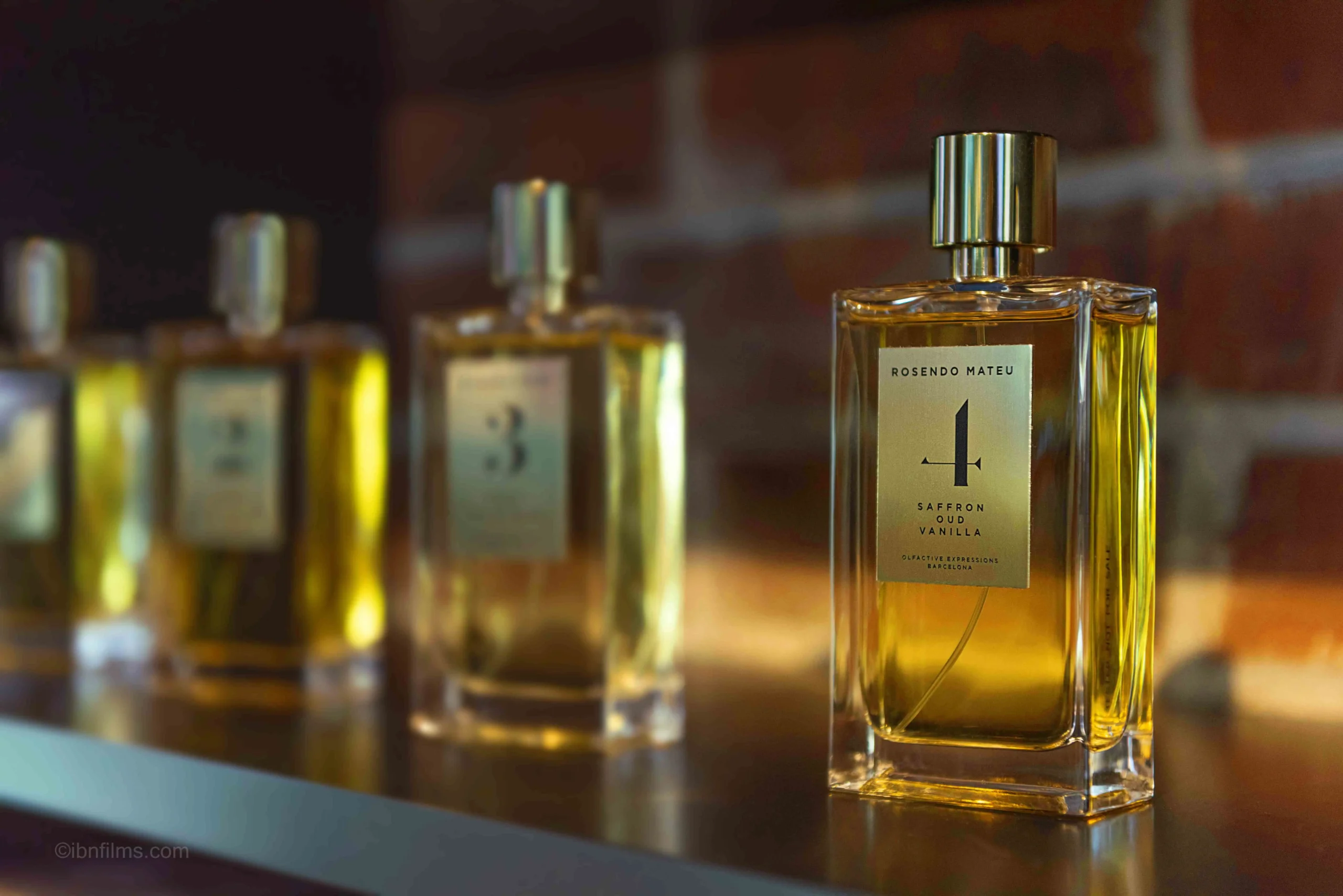 Luxury fragrance collection on a shelf professional photography by IBNFilms