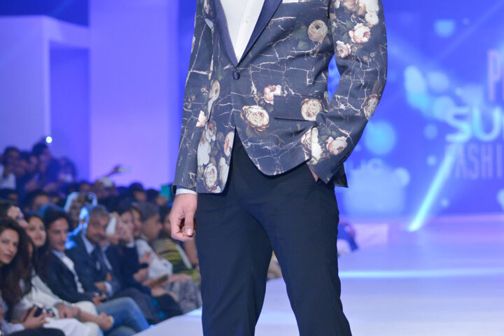 Menswear fashion runway photography in Dubai featuring world-famous Pakistani actor Fawad Khan walking as a model