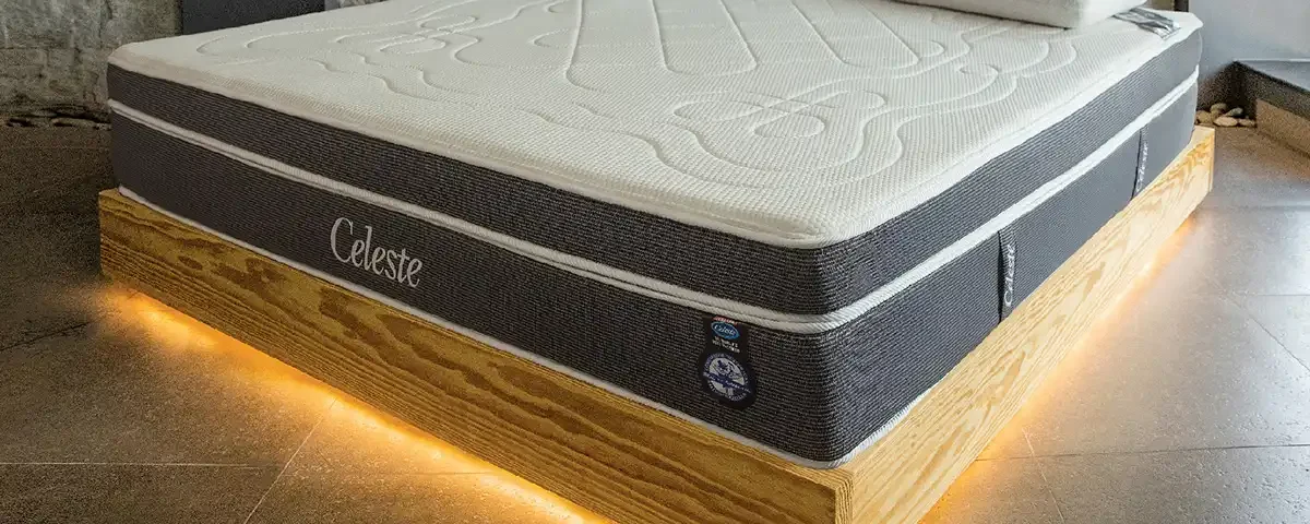 A luxurious modern bed frame featuring integrated LED accent lighting within a contemporary bedroom interior shoot in Dubai by IBN FILMS.