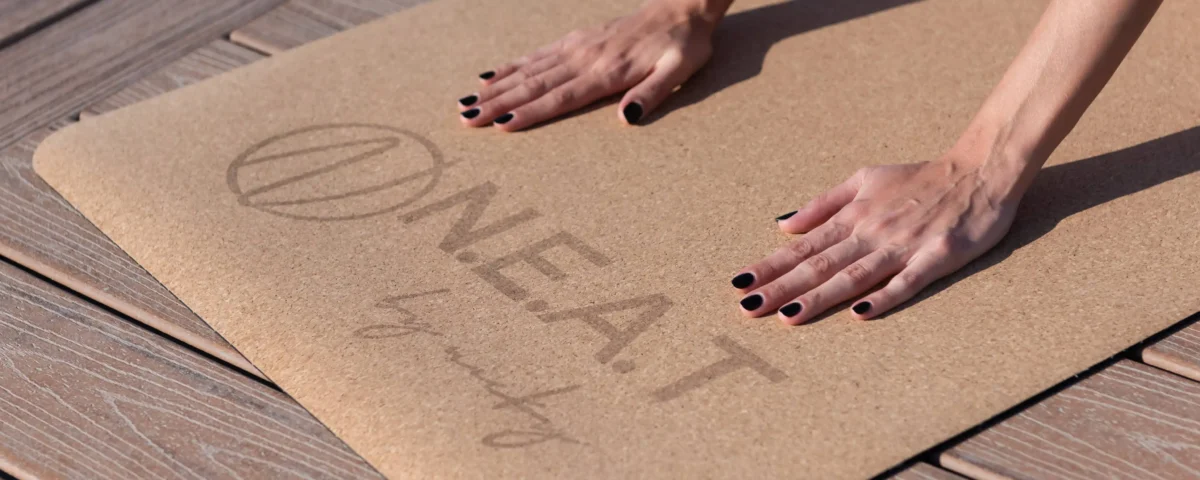 Macro close-up photography of NEAT yoga mat branding and texture by IBN FILMS.