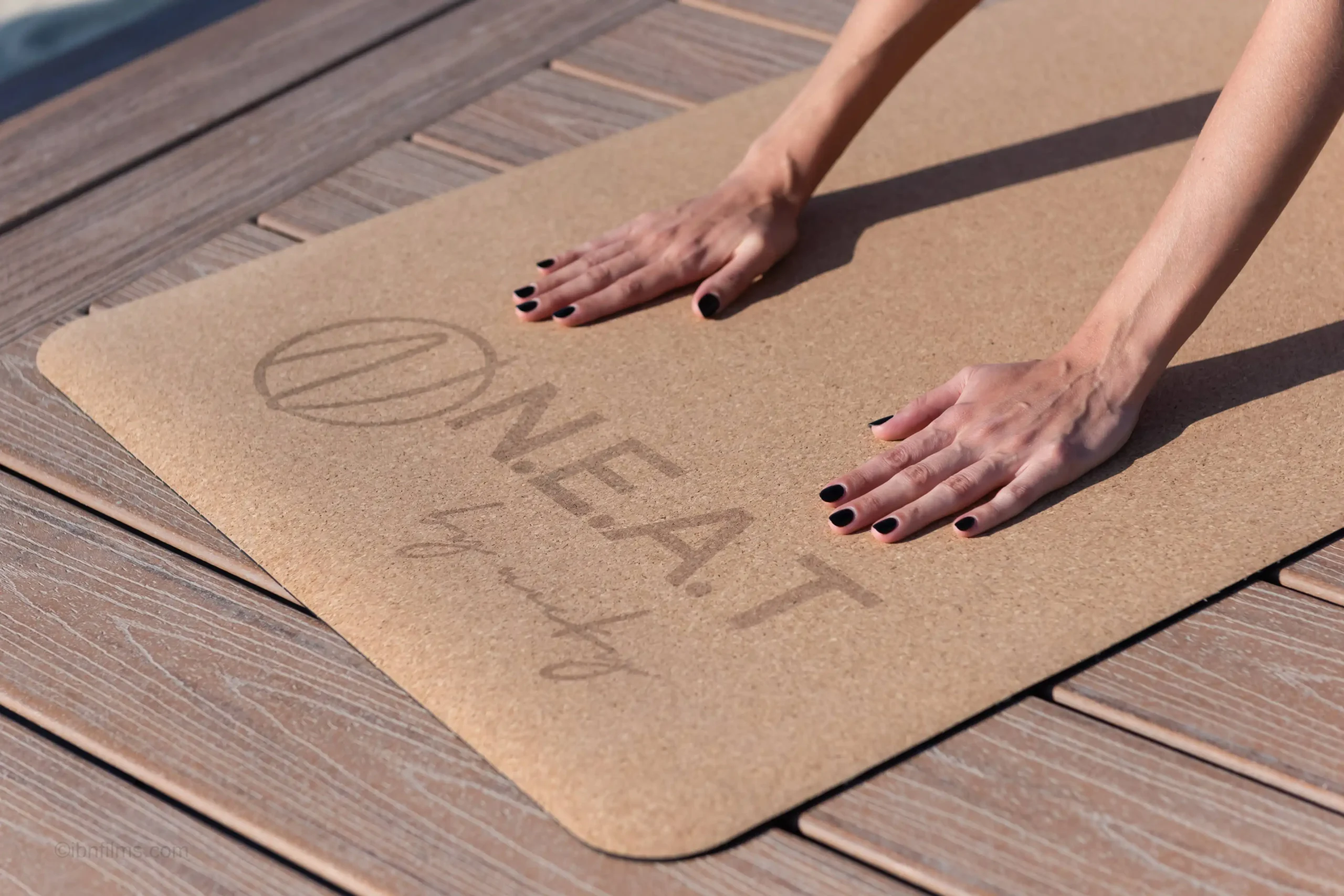 Macro close-up photography of NEAT yoga mat branding and texture by IBN FILMS.