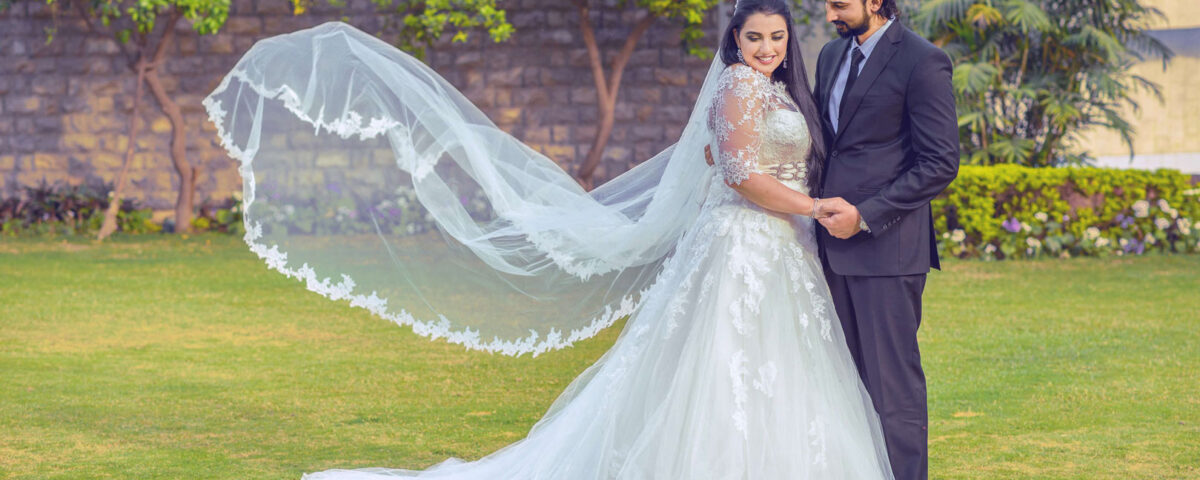 Outdoor wedding photography capturing a romantic wedding moment in a beautiful Dubai setting.