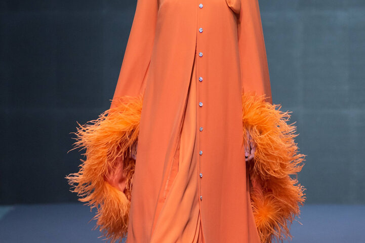 Model presenting a bold statement fashion look on a runway in Dubai, photographed by IBN Films