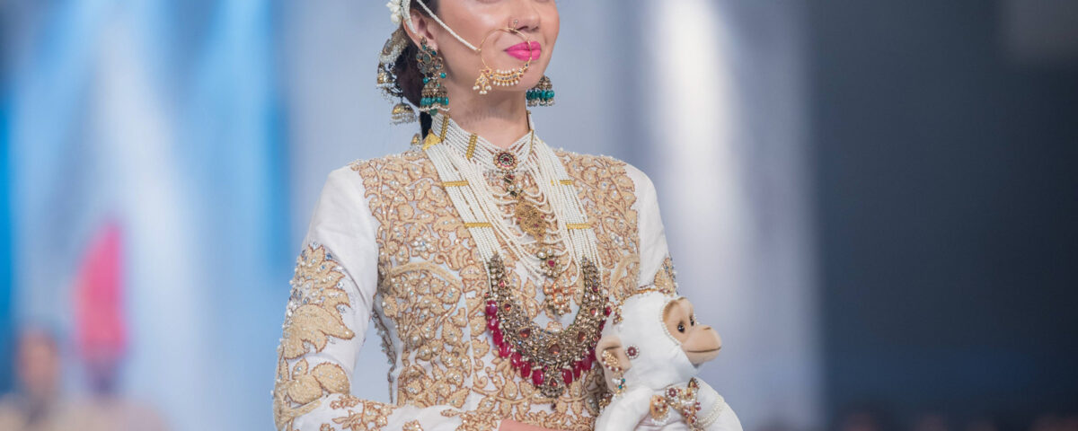 Pakistani actress Mahira Khan presenting traditional fashion on the runway at a fashion show in Dubai, photographed by IBN Films.